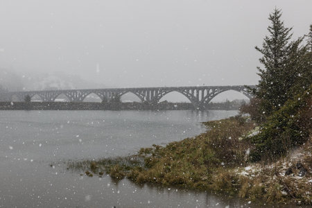 Isaac Lee Paterson bridge expanding across the Rogue river in extreme and rare winter conditions, Gold Beach, Oregon late February 2023の写真素材