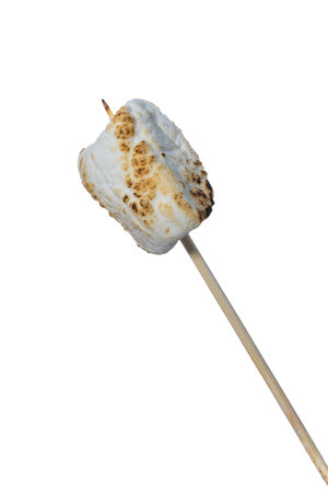 Close up of a toasted marshmallow on a stick isolated on a white backgroundの写真素材