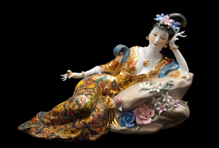 Chinese statuette geisha on black backgroundの写真素材