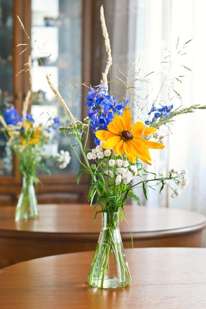 Bouquet of wild flowers on wooden tableの写真素材