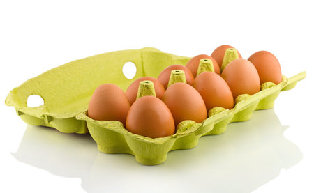 Ten eggs in package, on white background