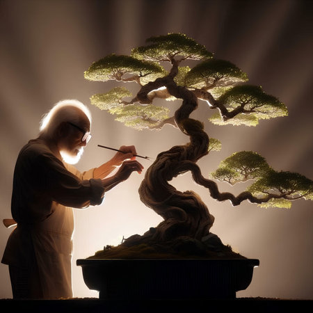 Senior Japanese artist painting bonsai tree in his workshop. Art concept.の素材