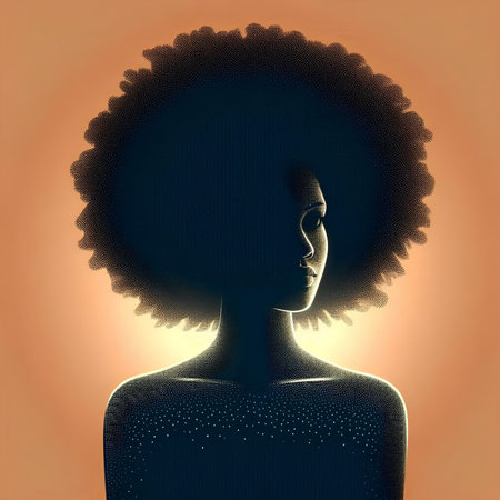 Silhouette of a girl with afro hairstyle on an orange backgroundの素材