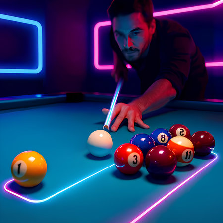 young man playing billiards in dark club with neon lights on backgroundの素材