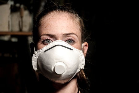 young girl with dust maskの写真素材