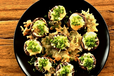 gratinate mushrooms with cheeseの写真素材