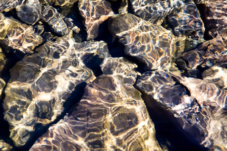 Rocks Reflecting Sunlight in Lake Superiorの写真素材