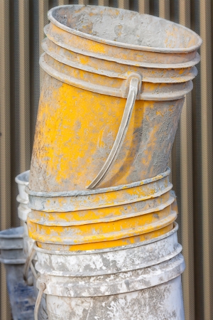 Cement Worker Bucket on the Construction Siteの写真素材