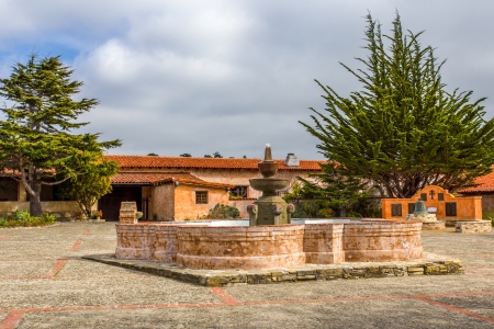 CARMEL, CA/USA - FEBRUARY 3: Central Courtyard and Fountain at the Carmel Mission, a Catholic Mission on the National Register of Historic Places and a U.S. National Historic Landmark.  February 3, 2013のeditorial素材