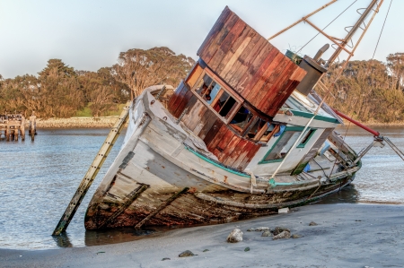 Shipwrecked Vessel Washed Ashore at Moss Landing, California.の写真素材