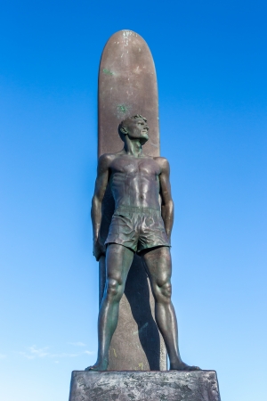 Santa Cruz, CA/ USA -- March 3:  "To Honor Surfing,"a  bronze of a male surfer standing in front of his board was created by sculptors Brian W. Curtis & Thomas Marsh.  March 3, 2013.のeditorial素材
