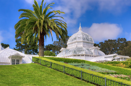 SAN FRANCISCO/USA - AUGUST 10: Historic Conservatory of Flowers is a greenhouse and botanical garden that houses a collection of rare and exotic plants in Golden Gate Park, San Francisco, California.  August 10, 2013.のeditorial素材