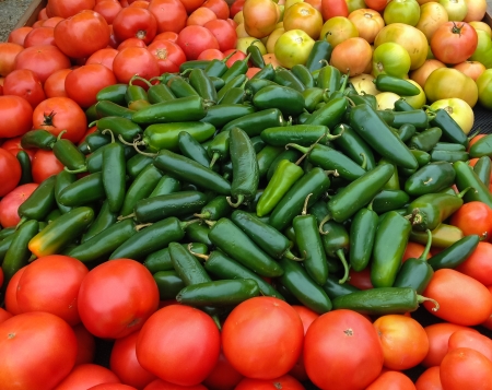 Green Jalapenos and Red Tomatoes at the Marketの写真素材