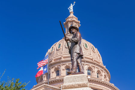 AUSTIN,TX/USA - NOVEMBER 15: Heroes of the Alamo Monument at the Texas State Capitol with backdrop of Texas State Capitol rotunda. November 15, 2013.のeditorial素材