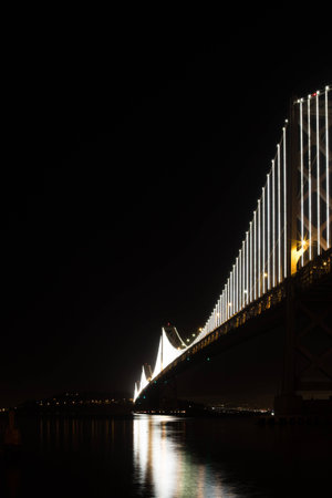Vertical Image of San Francisco Bay Bridge at Night When Fully Lit