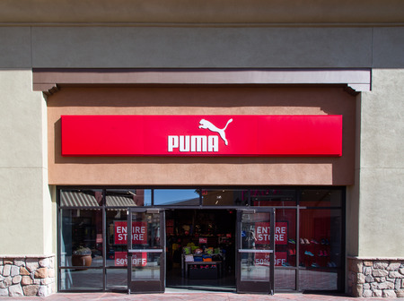 TEJON RANCH, CA/USA - SEPTEMBER 8, 2014: Puma store exterior and logo. Puma SE is a German company that produces athletic and casual footwear and sportswear.のeditorial素材