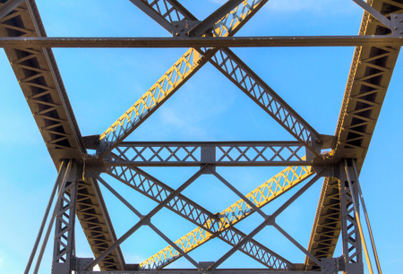 Overhead view of railroad bridge with blue sky and cloudsの写真素材