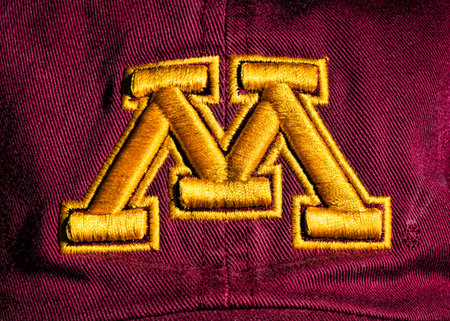 MINNEAPOLIS, MN/USA - JUNE 29, 2014: Minnesota Gophers ball cap and logo. The Minnesota Gophers are...