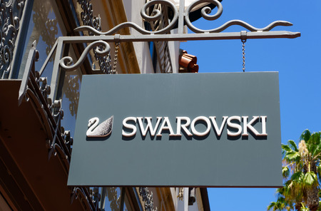 SANTA BARBARA, CA/USA - JULY 26, 2015: Swarovski store and sign. The Swarovski Crystal range includes crystal glass sculptures and luxury home decor.のeditorial素材