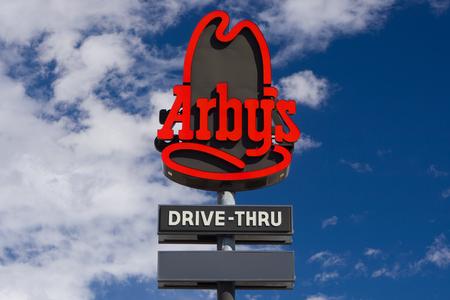 EVANSTON, WY/USA - OCTOBER 2, 2016 Arby's restaurant exterior and sign. Arby's is the second largest fast food sandwich chain in the United States.のeditorial素材