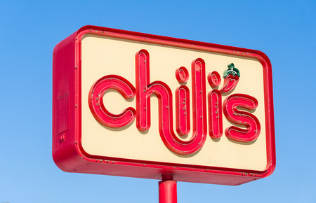 MINNEAPOLIS, MN/USA - JANUARY 14, 2017: Chili's restaurant exterior sign. Chili's Grill & Bar is an American casual dining restaurant chain that features Tex-Mex-style cuisine.のeditorial素材