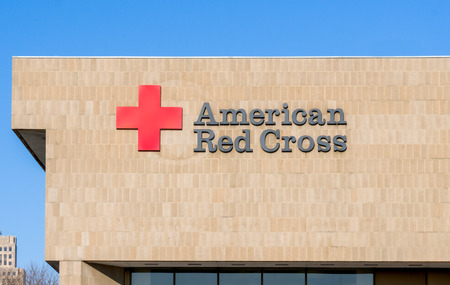 ST. PAUL, MN/USA - JANUARY 14, 2017: American Red Cross exterior sign and logo. The American Red Cross is a humanitarian organization that provides disaster relief and education in the United States.のeditorial素材
