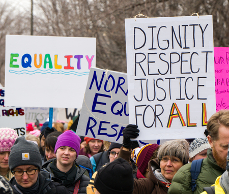 ST. PAUL, MN/USA - JANUARY 21, 2016: Unidentified particpants at the 2017 Women's March Minnesota. The Women's March represented the worldwide protest to protect women's rights and other causes.のeditorial素材