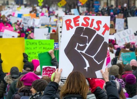 ST. PAUL, MN/USA - JANUARY 21, 2016: Unidentified particpants at the 2017 Women's March Minnesota. The Women's March represented the worldwide protest to protect women's rights and other causes.のeditorial素材