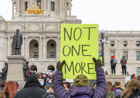 ST. PAUL, MN/USA - MARCH 24, 2018: Unidentified individuals participating in the March for our Lives protest at the Minnesota State Capitol.のeditorial素材