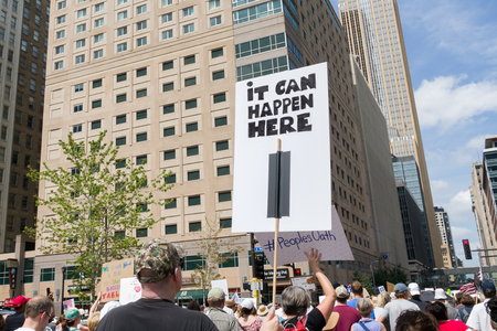 MINNEAPOLIS, MN/USA - JUNE 30, 2018: Unidentified individuals participating in the Families Belong Together march in protest of U.S. Immigration policy separating migrant children from parents.のeditorial素材