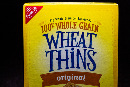 ST. PAUL, MN/USA - MARCH 4, 2019: Nabisco Wheat Thins and trademark logo.  National Biscuit Company is an American manufacturer of cookies and snacksのeditorial素材