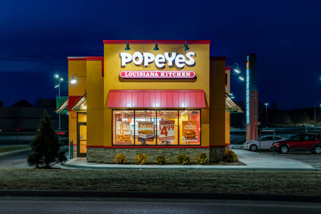 HUDSON, WI/USA - MARCH 8, 2020: Popeyes restaurant at twighlight and trademark logo.