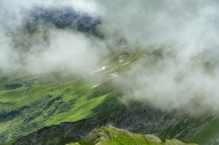 Mountain side in the clouds at the Nebelhorn.の写真素材