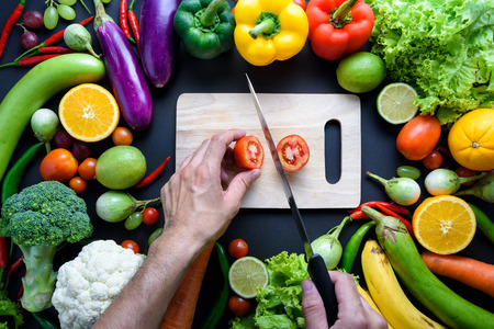 Healthy food concept of fresh organic vegetables and wooden desk background. Ingredients top viewの写真素材
