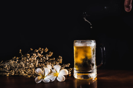 beer glass and bottle on black color blackgroundの写真素材