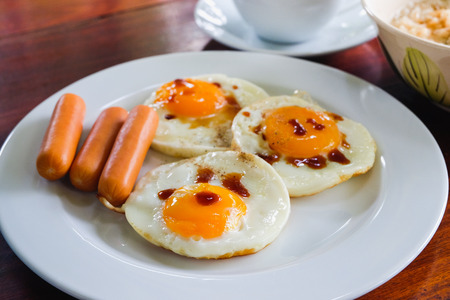 breakfast fire egg on wood tableの写真素材