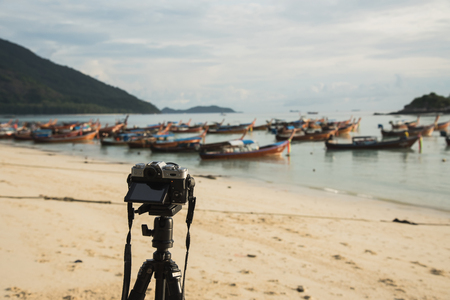 camera take photo fishing boat on the beachの写真素材