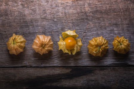 cape gooseberries on wooden backgroundの写真素材