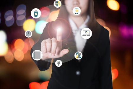 Business woman hand pushing buttonの写真素材