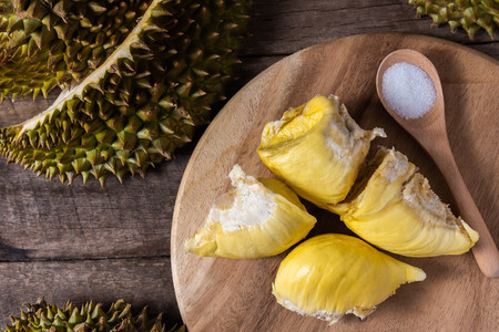 Durian fruit in Thailand on rustic wood tableの写真素材