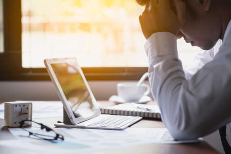 Businessman strain on desk office businessの写真素材