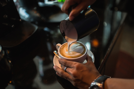 hand to make latte art coffeeの写真素材