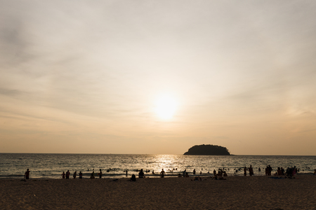 people rest on the beach sunsetの写真素材