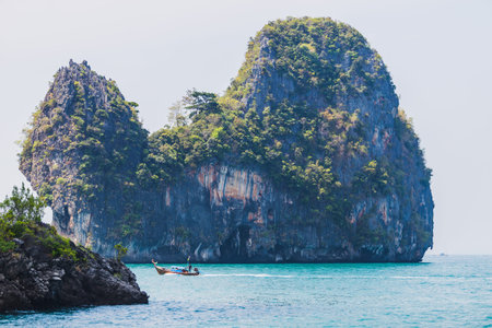 longtail boats near tropical island, Thailand