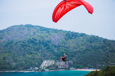 PHUKET, THAILAND -April 12 2014: An unidentified Paramania Paramotor show in Children day. Photo at Phuket, Thailandのeditorial素材