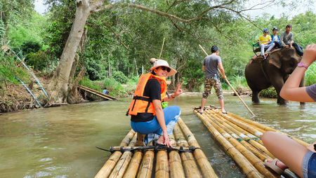 CHIANG MAI, THAILAND - JULY 18: Tourists are rafting trips in the creek with bamboo float rafting on July 18,2016 in Chiangmai Thailand -Northern Thailandのeditorial素材