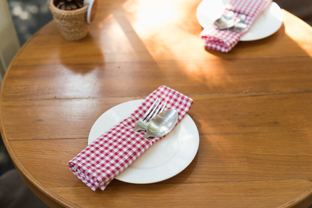 spoon and fork on wood tableの写真素材