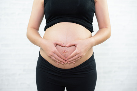 Close up of a cute pregnant bellyの写真素材