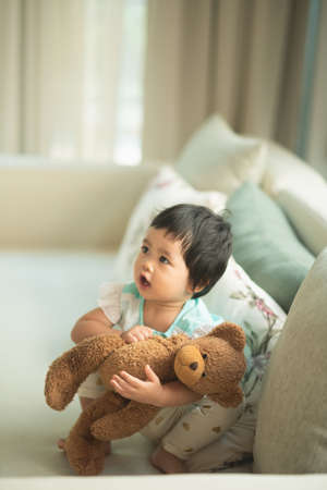 cute baby taking a shower in bathtubの写真素材