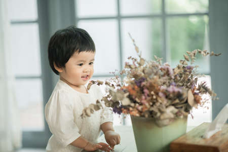 portrait of cute baby in the living roomの写真素材